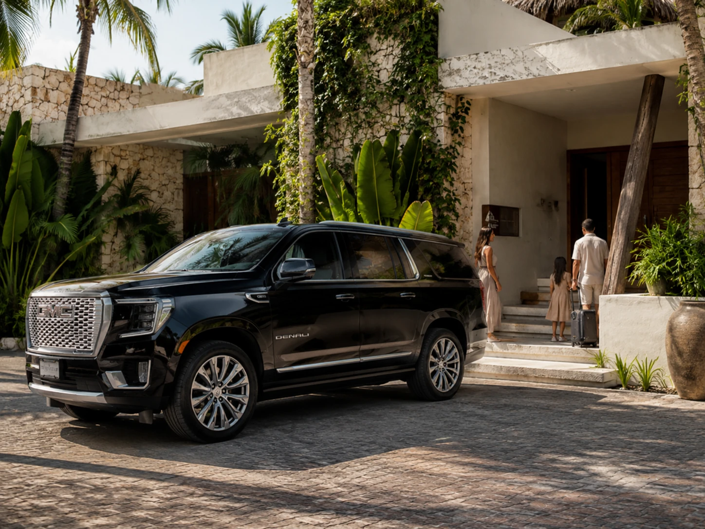 MeetPlaya hotel and Airbnb pickup image showing a luxury black SUV arriving at a tropical villa entrance.